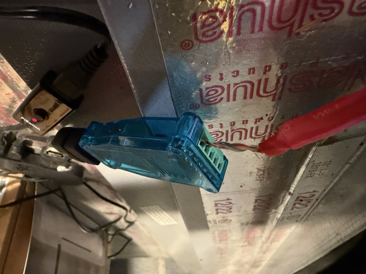 The adapter mounted by the air handler, cable landed, USB running to the CanaKit PiSwitch